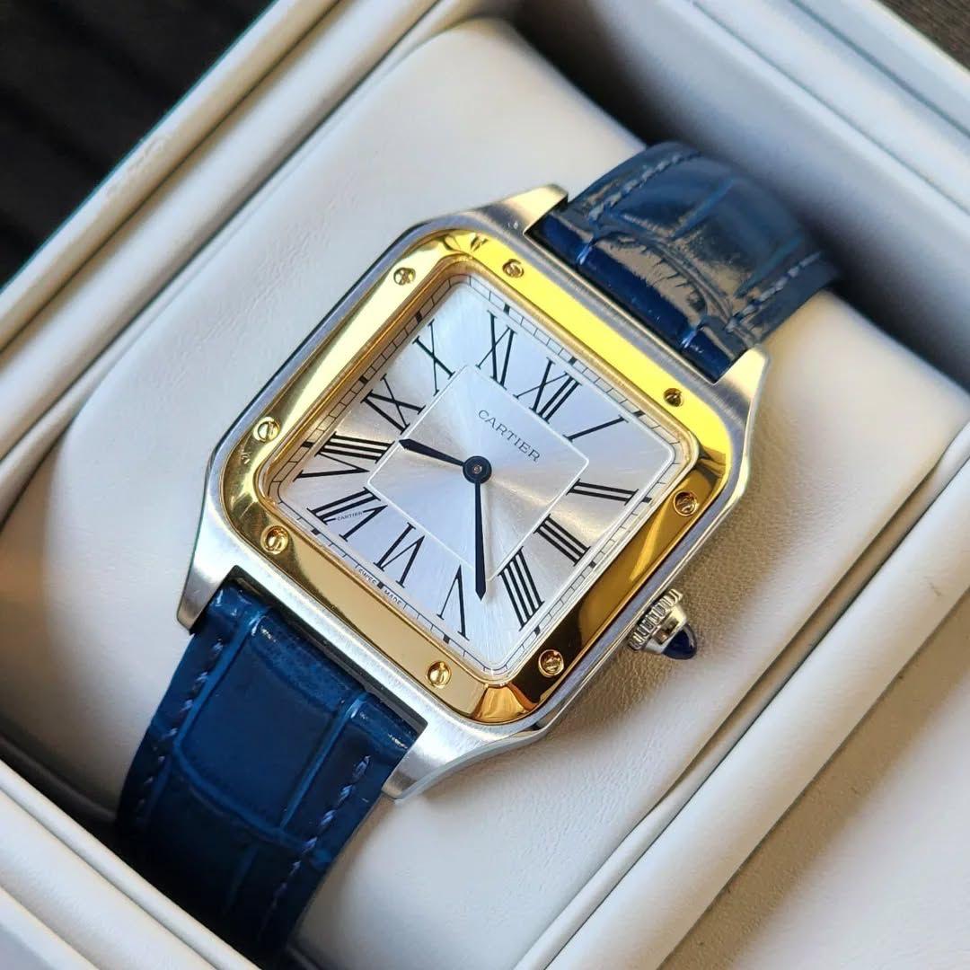 Montre Cartier Santos-Dumont acier et or jaune avec bracelet cuir bleu