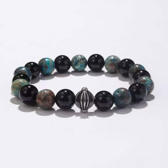 Bracelet perles noires brillantes et pierres turquoise avec perle centrale en acier